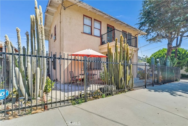 view of property exterior featuring a balcony