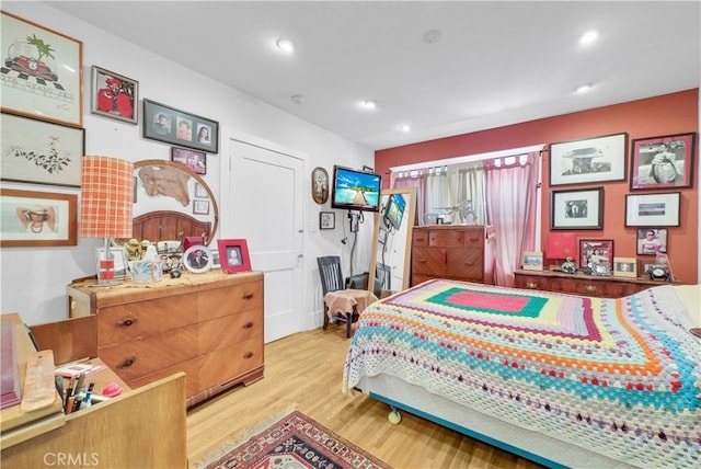 bedroom with light hardwood / wood-style flooring