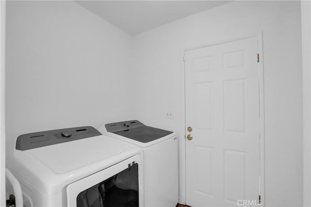 washroom featuring separate washer and dryer