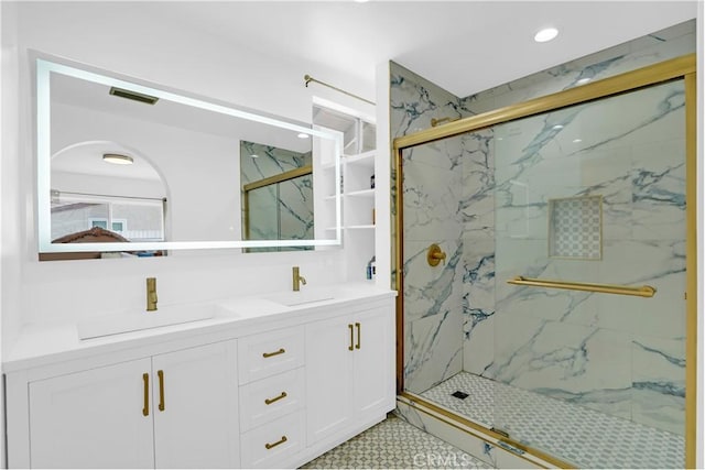 bathroom featuring walk in shower and vanity