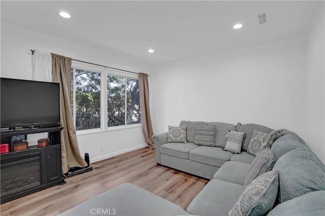 living room with light hardwood / wood-style floors