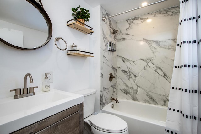 full bathroom featuring shower / bath combo with shower curtain, vanity, and toilet