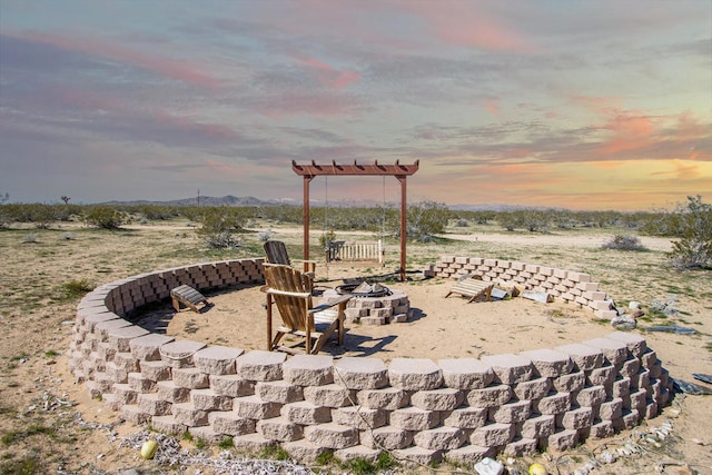 patio terrace at dusk with a fire pit