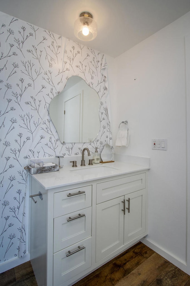 bathroom with vanity and hardwood / wood-style floors