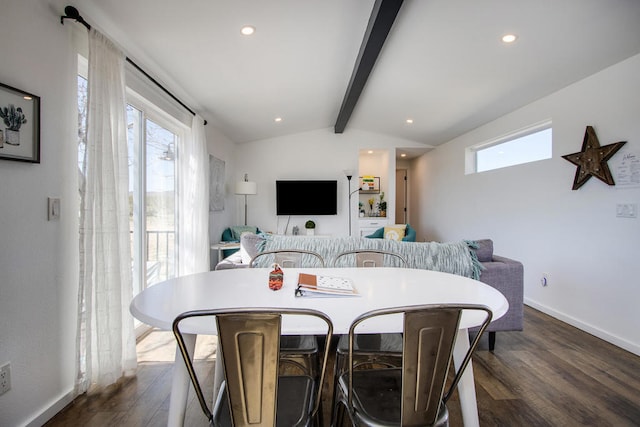 dining space featuring vaulted ceiling with beams, plenty of natural light, and dark hardwood / wood-style floors