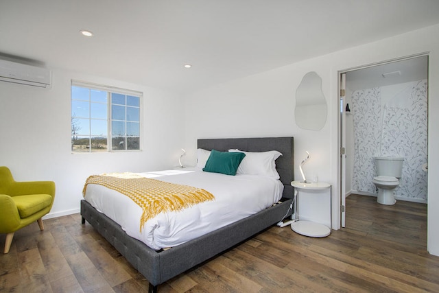 bedroom with dark wood-type flooring and a wall mounted air conditioner