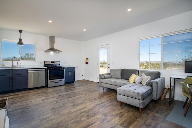 living room with dark hardwood / wood-style floors and sink