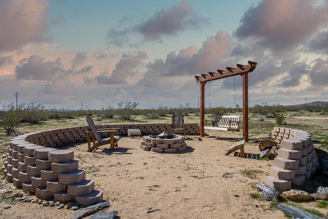 view of yard featuring a fire pit