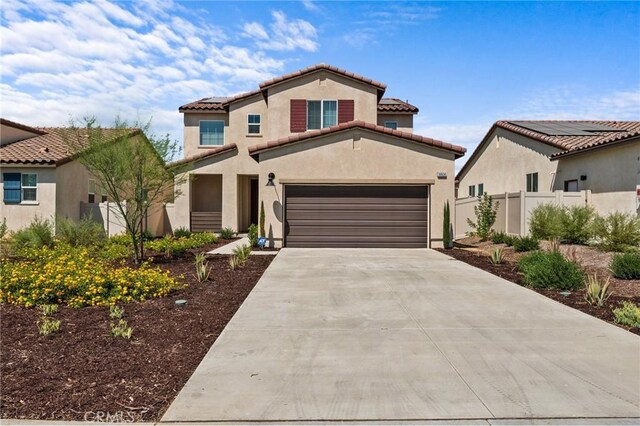 mediterranean / spanish-style house featuring a garage