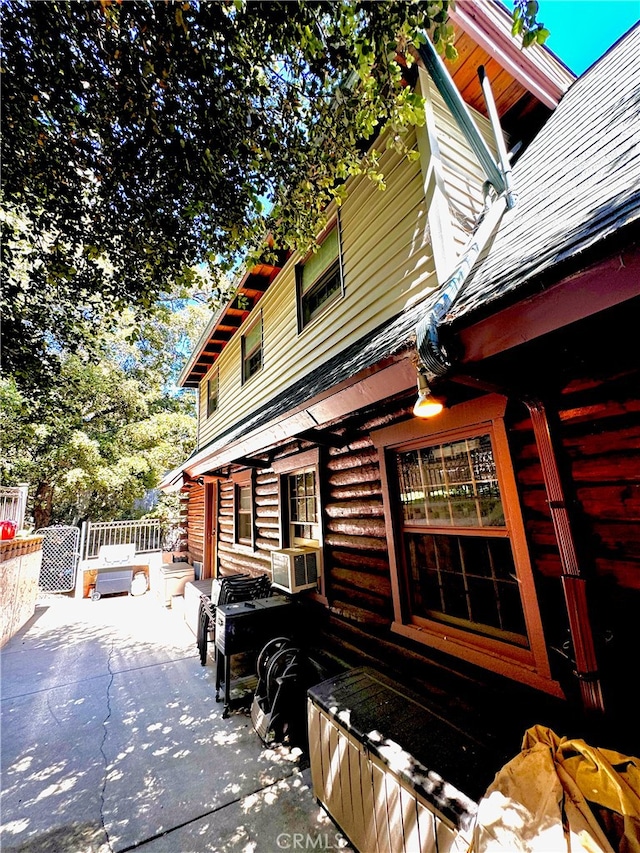 view of home's exterior with a patio and cooling unit