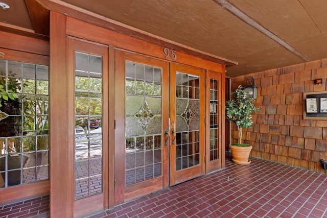 entryway featuring french doors and wooden ceiling