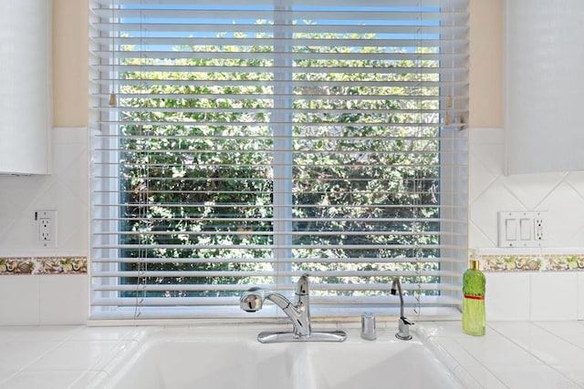 room details featuring light countertops and a sink