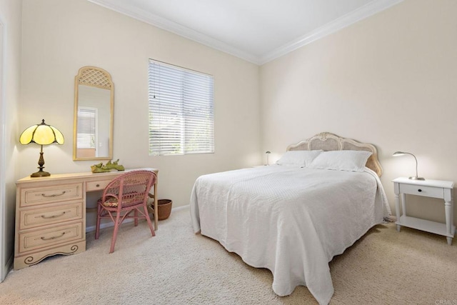 bedroom with carpet floors, baseboards, and crown molding