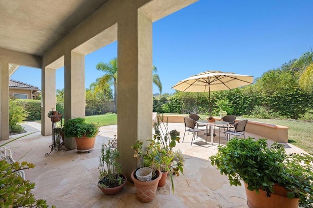 view of patio featuring fence