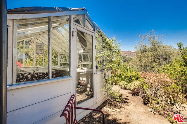 view of home's exterior with a mountain view