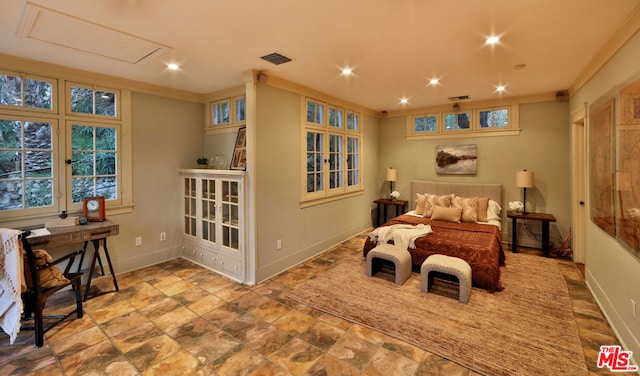 bedroom with crown molding