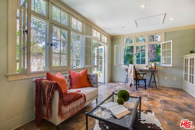 sunroom / solarium featuring a healthy amount of sunlight