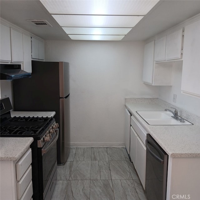 kitchen featuring sink, white cabinetry, black dishwasher, and stainless steel gas range oven