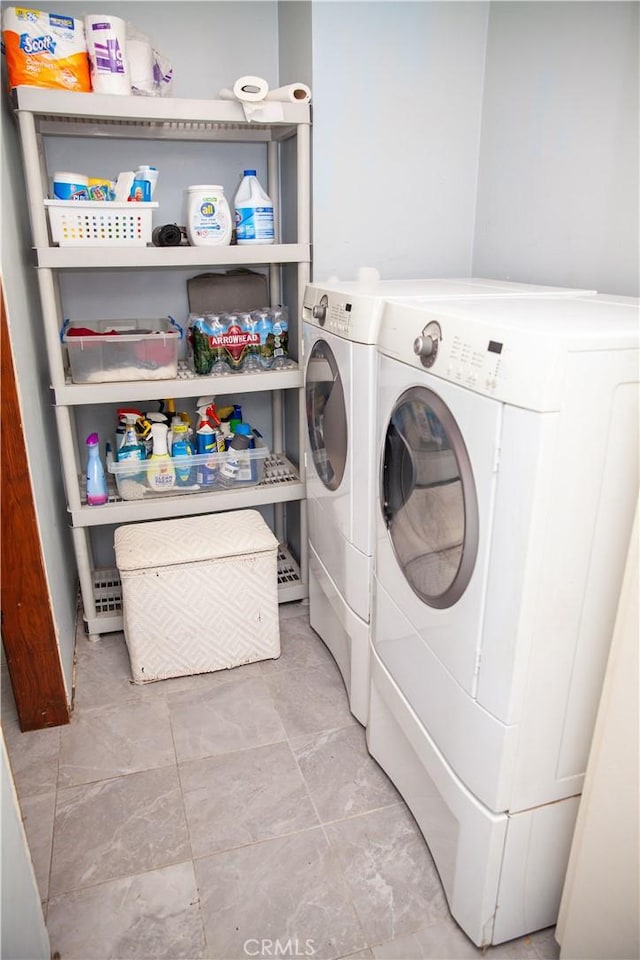 laundry room featuring washing machine and clothes dryer