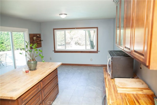 clothes washing area with a healthy amount of sunlight and separate washer and dryer