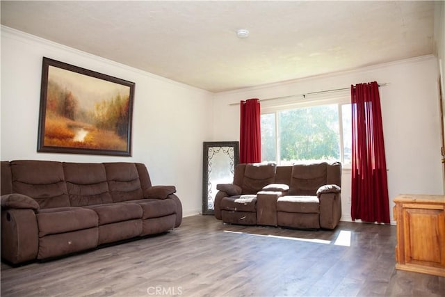 living room with hardwood / wood-style flooring and ornamental molding