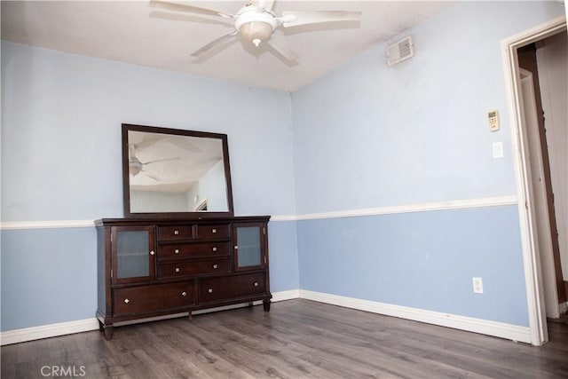 interior space featuring ceiling fan and wood-type flooring