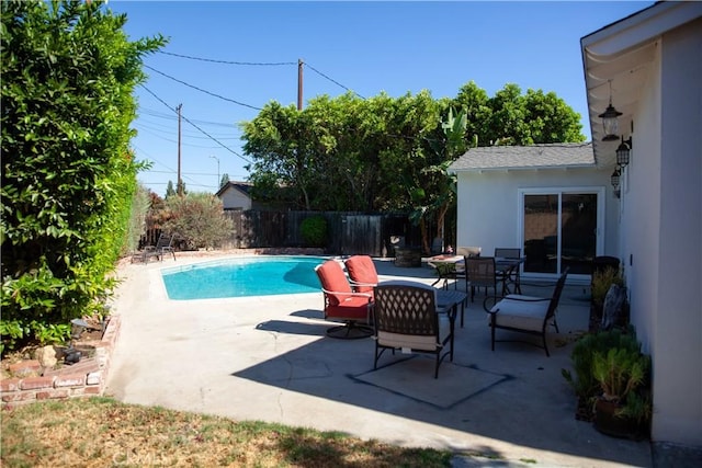 view of swimming pool featuring a patio