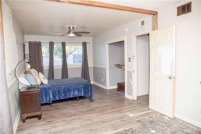 bedroom featuring ceiling fan and hardwood / wood-style floors