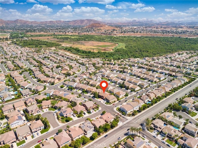 birds eye view of property with a mountain view