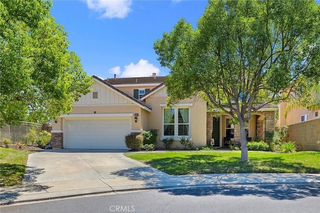 view of front of property featuring a garage and a front yard