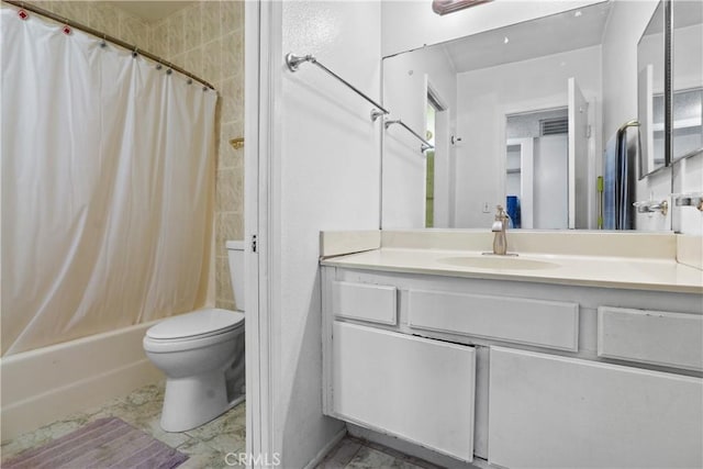 full bathroom featuring vanity, shower / bath combination with curtain, and toilet