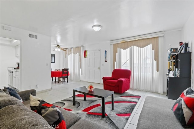 living room with ceiling fan and light tile patterned flooring