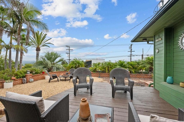 deck featuring an outdoor fire pit