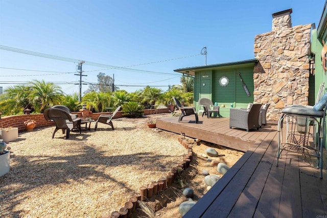 view of yard with outdoor lounge area and a wooden deck