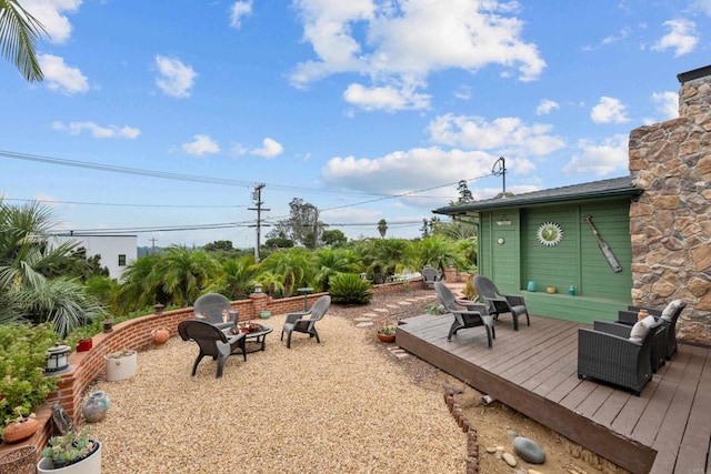 view of yard with a fire pit and a deck