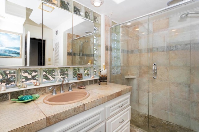 bathroom with vanity and walk in shower