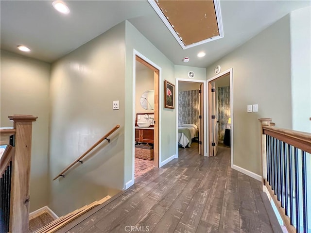 hallway with dark hardwood / wood-style floors