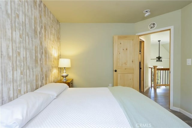 bedroom with dark wood-type flooring