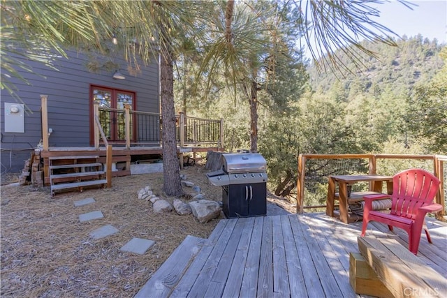 wooden terrace with area for grilling