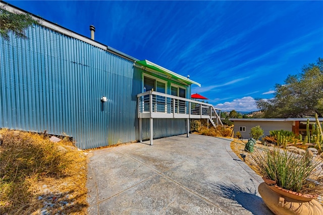 view of property exterior with a balcony