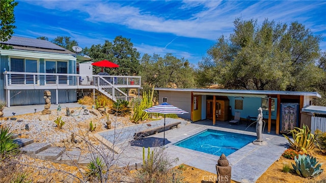 view of swimming pool with a patio area