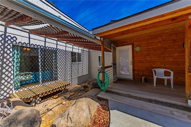 wooden terrace with a pergola