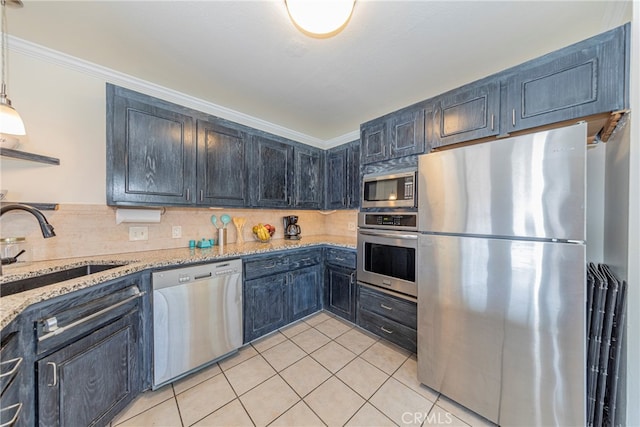 kitchen with decorative backsplash, light stone counters, pendant lighting, stainless steel appliances, and ornamental molding