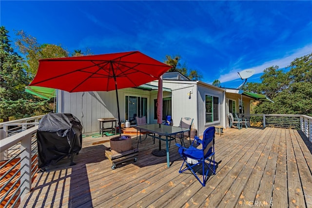 wooden deck featuring area for grilling