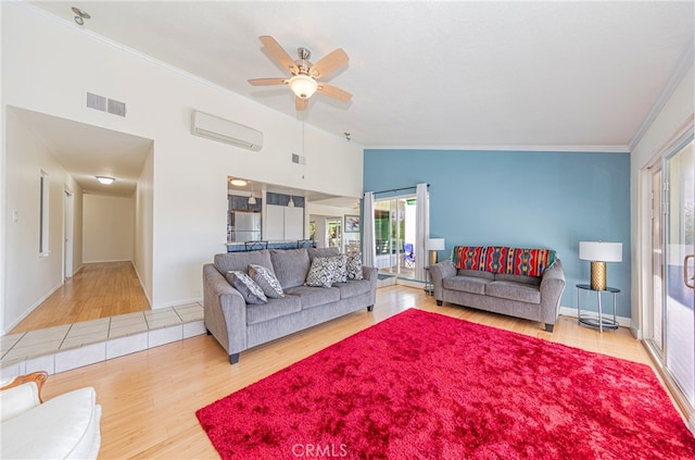 living room with ceiling fan, lofted ceiling, a wall mounted AC, wood-type flooring, and crown molding