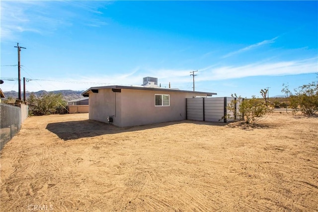 view of side of property featuring central AC unit