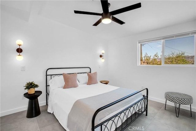 tiled bedroom with ceiling fan