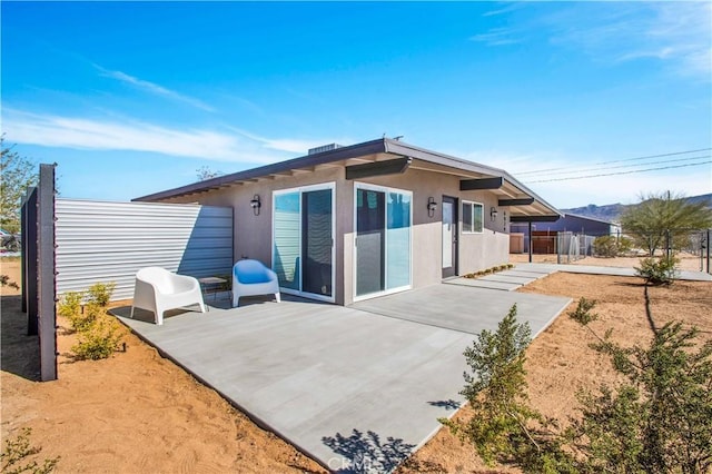 back of property with a patio area