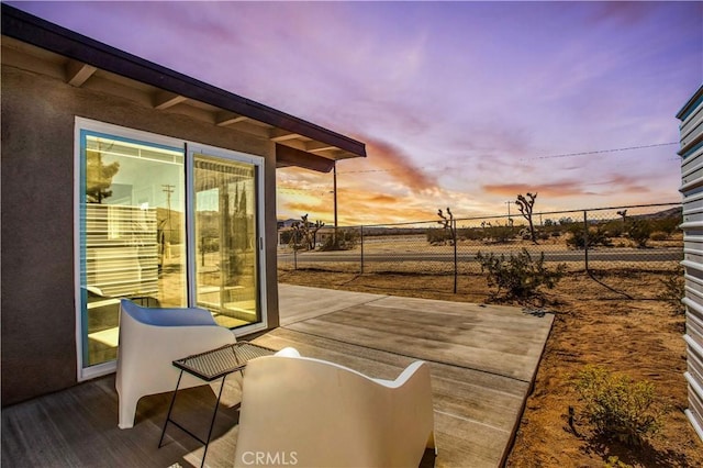 view of patio terrace at dusk