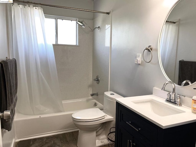 full bathroom featuring vanity, shower / tub combo, and toilet